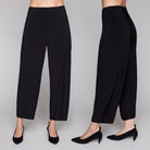 Black lantern pants worn by a person on a plain background