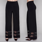 Black wide-leg pants with sheer mesh at the bottom on a gray background