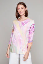 Woman smiling in pastel swirl 3/4 sleeve top