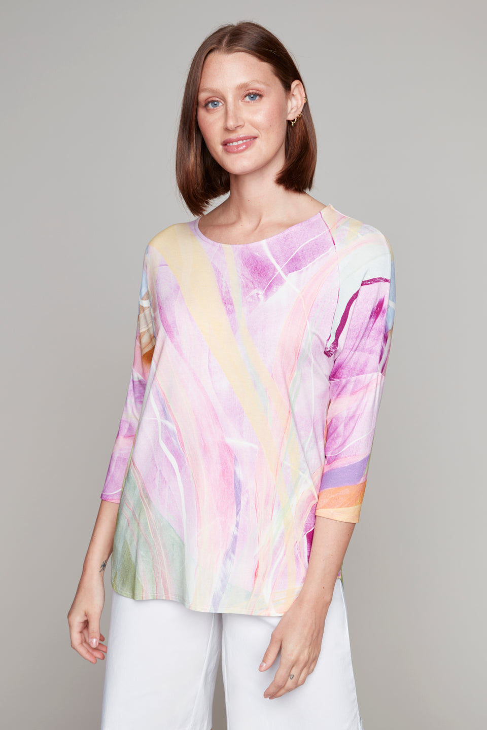 Woman smiling in pastel swirl 3/4 sleeve top