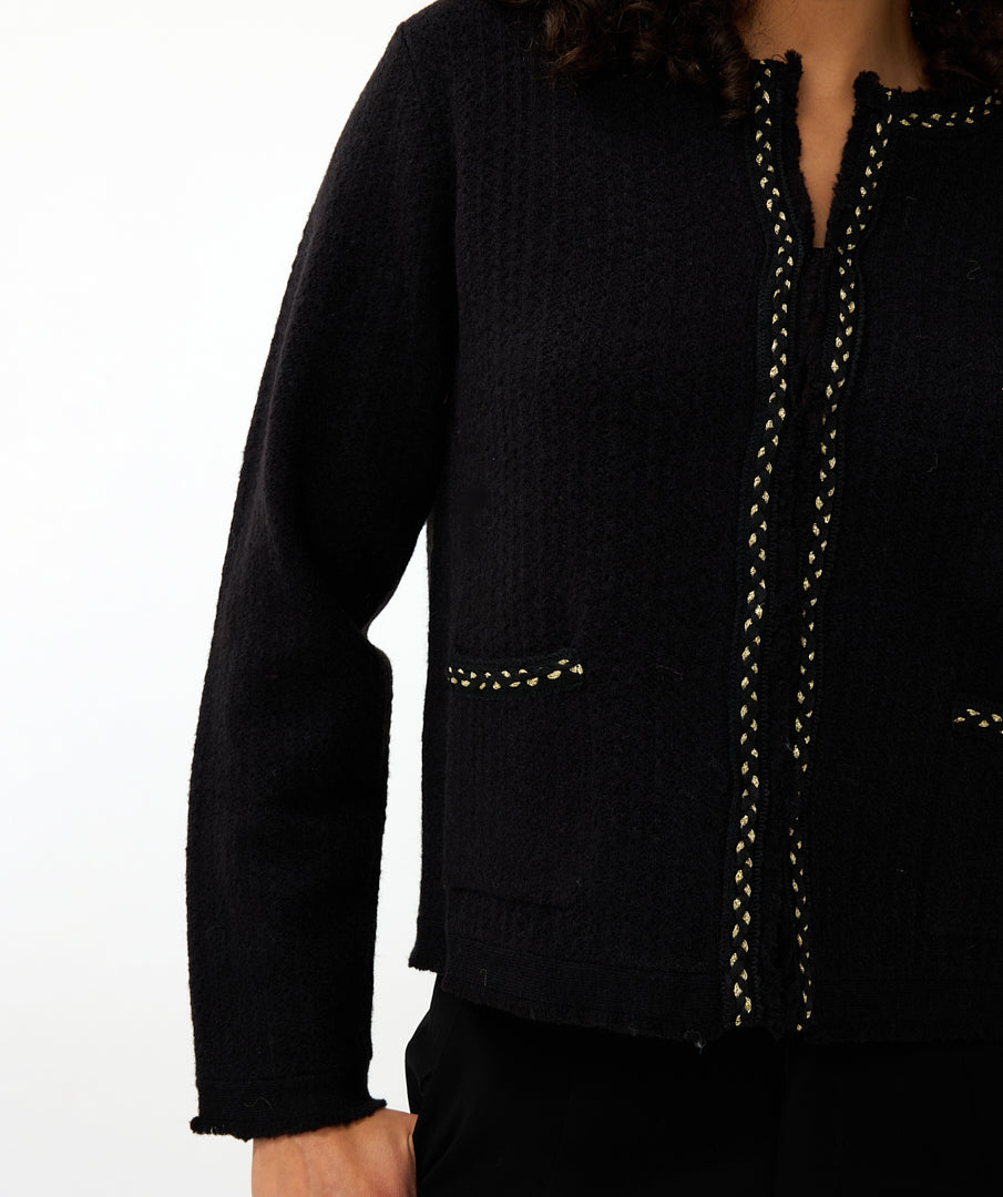 Black jacket with decorative stitching on a white background