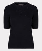 Off Figure Black short-sleeve sweater with subtle pattern on a light gray background