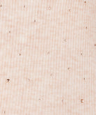 Close-up of a textured beige fabric surface
