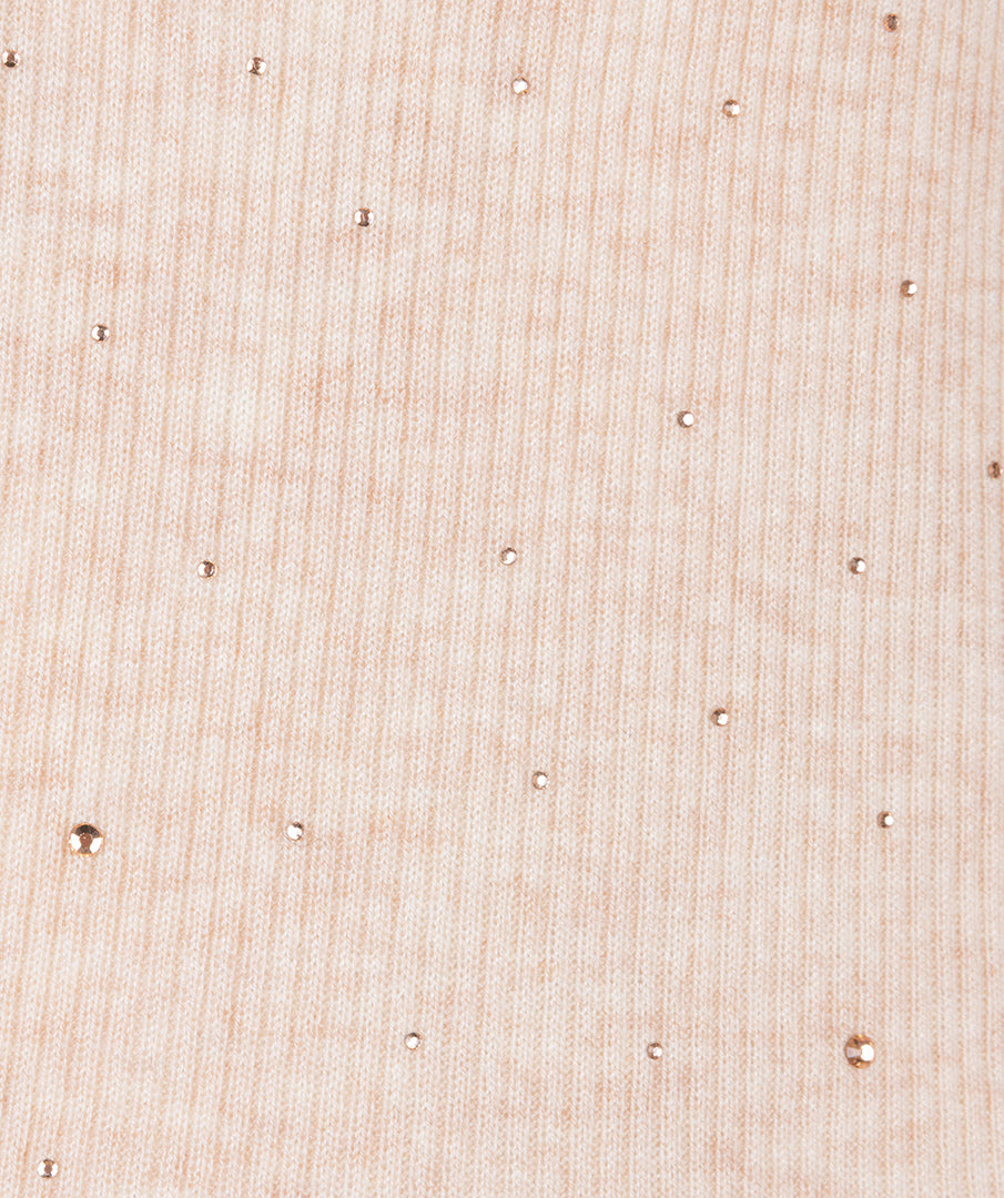 Close-up of a textured beige fabric surface