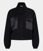 Black jacket with two front pockets on a light gray background