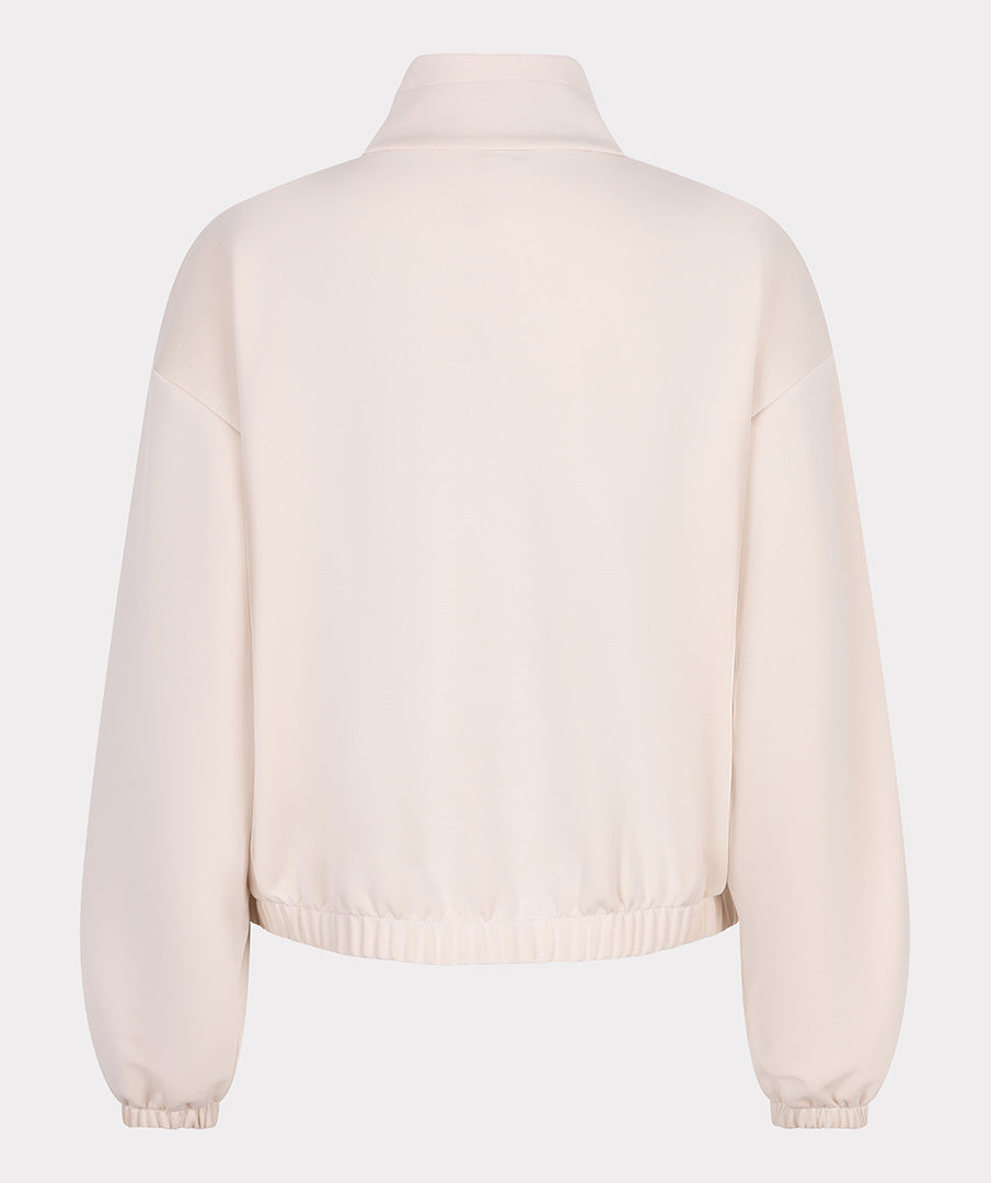 Beige sweatshirt on a light gray background