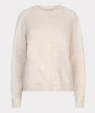 Beige sweater on a light gray background