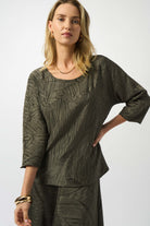 close up of woman wearing deep-green shirt
